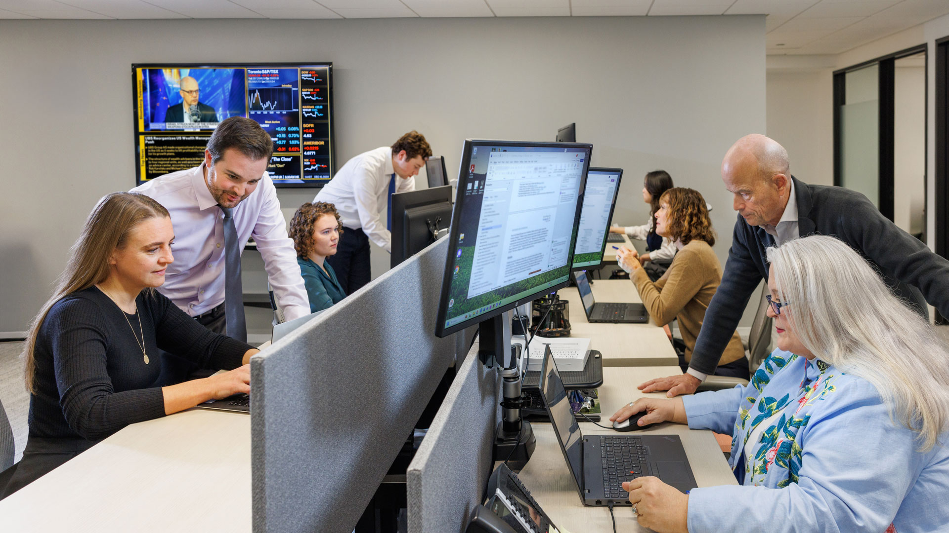 IGI employees at work on their computers