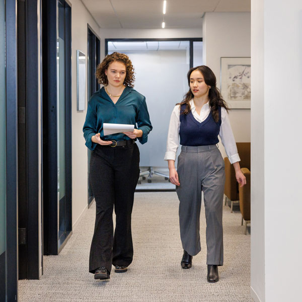 Women employees walking and talking